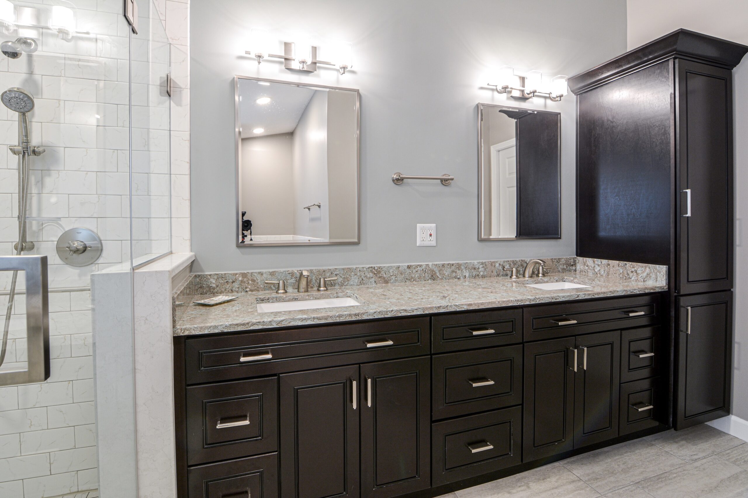 double vanity with quartz countertop and mirrors.