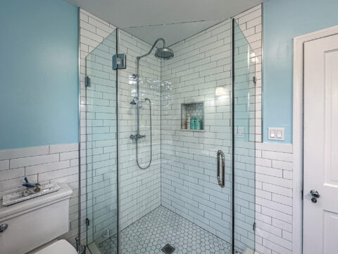 Bright Walk-In Shower with Niche Shelf and Chrome Rain Showerhead