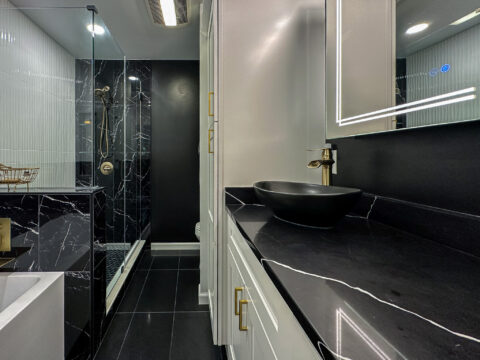 Contemporary Black and White Bathroom with Bold Tile and Integrated Storage