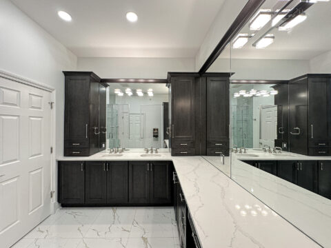 Extended Double Vanity with Tower Cabinets and High-End Lighting