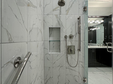 Marble Look Tile Walk-In Shower with Built-In Bench and Grab Bar