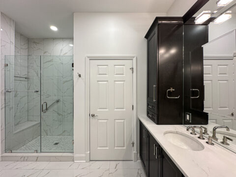 Modern Bathroom Renovation with Glass Shower and Marble Porcelain Flooring