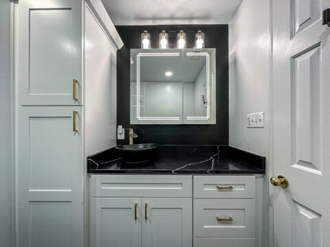 Sleek Floating Vanity with Matte Black Vessel Sink and Brass Faucet